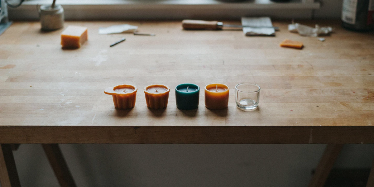 Golden beeswax votives freshly released from a silicone mold