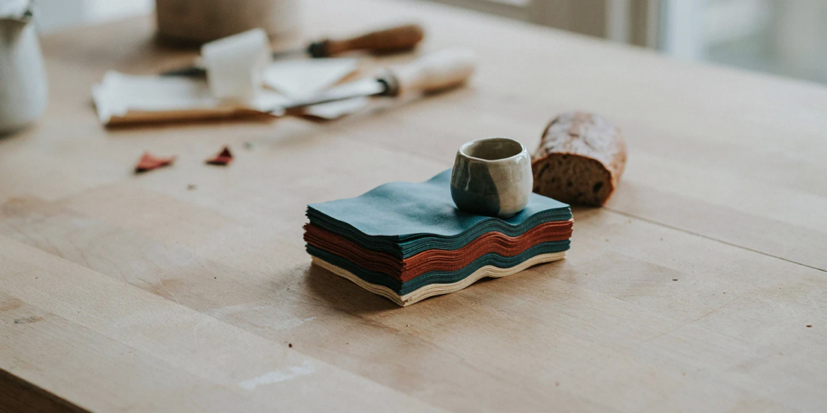Cotton squares coated in beeswax folded into a stack