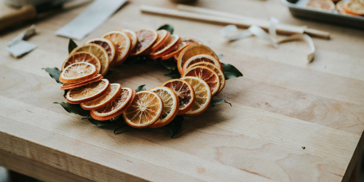 A wreath of overlapping dried orange slices with bay leaves