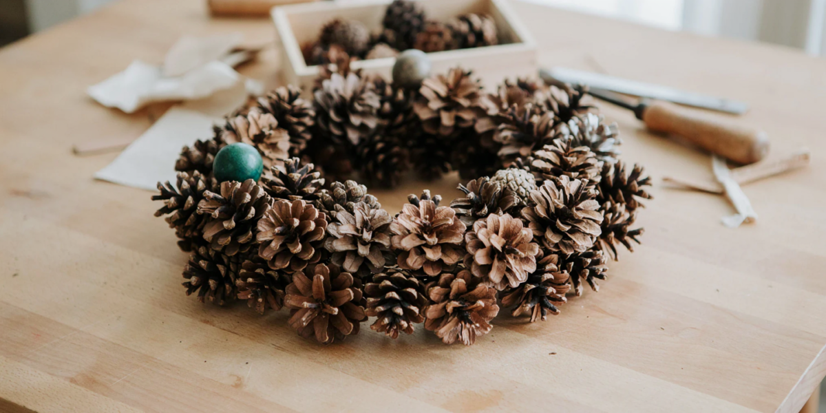 A dense wreath made entirely of pinecones of different sizes