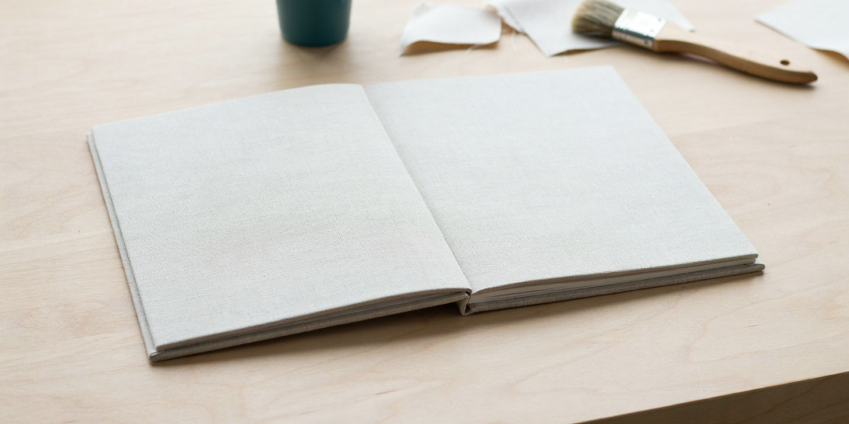 A notebook covered in printed cotton fabric with the edges folded inside